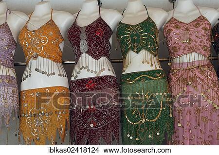 Mannequins wearing Arabic belly-free clothes for sale, Deira, Old Souk, Dubai, United Arab Emirates, Middle East, Asia View Large Photo Image Picture - Mannequins wearing Arabic belly-free clothes for sale, Deira, Old Souk, Dubai, United Arab Emirates, Middle East, Asia. Fotosearch