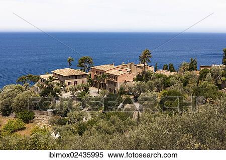 "Mansions on the coast near Deia, Serra de Tramuntana, northwest coast, Mallorca, Balearic Islands, Mediterranean Sea, Spain, Europe" View Large Photo Image Stock Photography - "Mansions on the coast near Deia, Serra de Tramuntana, northwest coast, Mallorca, Balearic Islands, Mediterranean Sea, Spain, Europe". Fotosearch