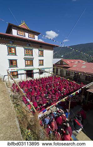 "Many nuns wearing red cloths listening the teachings of Taklung Tsetru Rinpoche in the backyard of Junbesi Gompa, Junbesi, Solukhumbu District, Sagarmatha Zone, Nepal, Asia" View Large Photo Image Stock Photography - "Many nuns wearing red cloths listening the teachings of Taklung Tsetru Rinpoche in the backyard of Junbesi Gompa, Junbesi, Solukhumbu District, Sagarmatha Zone, Nepal, Asia". Fotosearch
