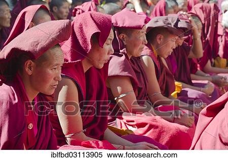 "Many nuns wearing red cloths listening the teachings of Taklung Tsetru Rinpoche in the backyard of Junbesi Gompa, Junbesi, Solukhumbu District, Sagarmatha Zone, Nepal, Asia" View Large Photo Image Stock Photography - "Many nuns wearing red cloths listening the teachings of Taklung Tsetru Rinpoche in the backyard of Junbesi Gompa, Junbesi, Solukhumbu District, Sagarmatha Zone, Nepal, Asia". Fotosearch
