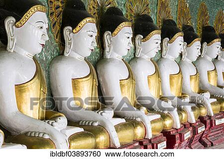 "Many seated Buddha sculptures, walls decorated with glass mosaics, Umin Thounzeh, Umin Thonse or U Min Thonze Pagoda or 30 Caves Pagoda, Sagaing Hills near Mandalay, Myanmar, Asia" View Large Photo Image Stock Image - "Many seated Buddha sculptures, walls decorated with glass mosaics, Umin Thounzeh, Umin Thonse or U Min Thonze Pagoda or 30 Caves Pagoda, Sagaing Hills near Mandalay, Myanmar, Asia". Fotosearch