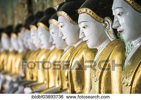 "Many seated Buddha sculptures, walls decorated with glass mosaics, Umin Thounzeh, Umin Thonse or U Min Thonze Pagoda or 30 Caves Pagoda, Sagaing Hills near Mandalay, Myanmar, Asia" View Large Photo Image Stock Photograph - "Many seated Buddha sculptures, walls decorated with glass mosaics, Umin Thounzeh, Umin Thonse or U Min Thonze Pagoda or 30 Caves Pagoda, Sagaing Hills near Mandalay, Myanmar, Asia". Fotosearch