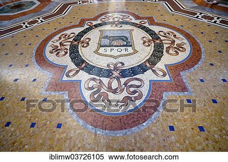 Stock Photography - "Marble floor mosaic, coat of arms of Rome, SPQR, luxury shopping arcade Galleria Vittorio Emanuele II, Milan, Lombardy, Italy, Europe". Fotosearch
