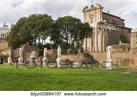 Stock Photo - "Marble sculptures in the House of the Vestal Virgins, Atrium Vestae, 193-211 AD, at the back the Temple of Antoninus and Faustina, Tempio di Antonio e Faustina, 141 AD, Roman Forum, Rome, Lazio, Italy, Europe". Fotosearch