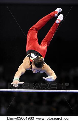 Stock Image - "Marcel Nguyen, GER, performing on high bar, EnBW Gymnastics World Cup 2012, Men, Porsche-Arena, Stuttgart, Baden-Wurttemberg, Germany, Europe". Fotosearch