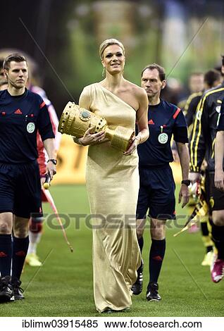 Stock Photography - "Maria Hofl-Riesch carries the DFB Cup into the stadium, opening ceremony, DFB Cup final, Olympiastadion, Berlin, Germany, Europe". Fotosearch