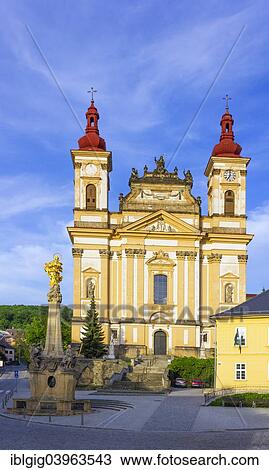 Stock Image - "Marian column and church of Annunciation of Virgin Mary, Sternberk, Olomouc district, Olomoucky region, Czech Republic, Europe". Fotosearch