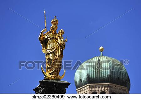 "Mariensaeule column against a blue sky, a steeple of Frauenkirche church at the back, Marienplatz square, Munich, Bavaria, Germany, Europe" View Large Photo Image Stock Photo - "Mariensaeule column against a blue sky, a steeple of Frauenkirche church at the back, Marienplatz square, Munich, Bavaria, Germany, Europe". Fotosearch