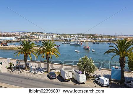Stock Photo - "Marina and promenade, harbour entrance of Lagos, Algarve, Portugal, Europe". Fotosearch