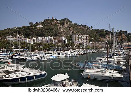 "Marina in front of the hill with Castell Ermita de Sant Joan Castle, Blanes, La Selva, Costa Brava, Catalonia, Spain, Europe, PublicGround, Europe" View Large Photo Image Stock Photo - "Marina in front of the hill with Castell Ermita de Sant Joan Castle, Blanes, La Selva, Costa Brava, Catalonia, Spain, Europe, PublicGround, Europe". Fotosearch