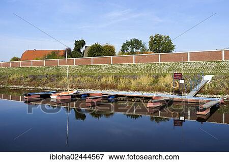 "Marina with a flood protection wall in Stiepelse, Amt Neuhaus, Lower Saxony, Germany, Europe" View Large Photo Image Stock Photo - "Marina with a flood protection wall in Stiepelse, Amt Neuhaus, Lower Saxony, Germany, Europe". Fotosearch