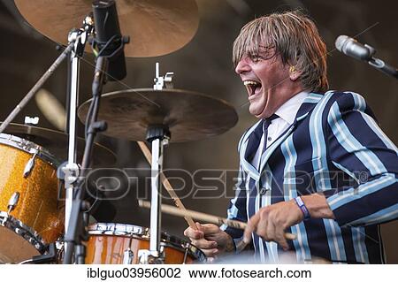 Stock Image - "Mario Goossens, drummer of the Belgian rock band Triggerfinger, performing live at Heitere Open Air, Zofingen, Canton of Aargau, Switzerland, Europe". Fotosearch