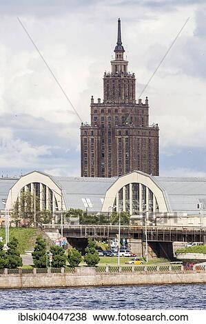 "Market halls, central market, with the high rise building of the Latvian Academy of Sciences on the Daugava river or Western Dvina, Riga, Latvia, Europe" View Large Photo Image Stock Photo - "Market halls, central market, with the high rise building of the Latvian Academy of Sciences on the Daugava river or Western Dvina, Riga, Latvia, Europe". Fotosearch