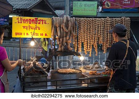 Stock Photography - "Market in the evening with a barbecue, Chiang Rai, Thailand, Asia". Fotosearch