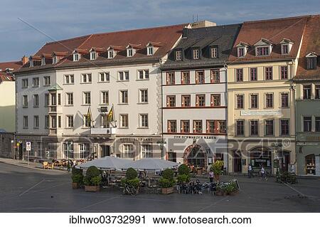 Stock Image - "Market square in the evening light, with the Elephant Hotel and the Schwarzer Baer inn, Weimar, Thuringia, Germany, Europe". Fotosearch