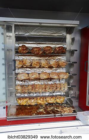 Stock Photo - "Market stall with a chicken grill and fried chicken, Bedoin, Vaucluse, Provence-Alpes-Cote d'Azur, Southern France, France, Europe". Fotosearch