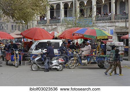 "Market stalls with Muslim traders and a tea room on the porch of a mudbrick house, Uyghur Muslim Quarter, Kashgar, Seidenstrasse, Xinjiang, China, People's Republic of China, Asia" View Large Photo Image Stock Photograph - "Market stalls with Muslim traders and a tea room on the porch of a mudbrick house, Uyghur Muslim Quarter, Kashgar, Seidenstrasse, Xinjiang, China, People's Republic of China, Asia". Fotosearch