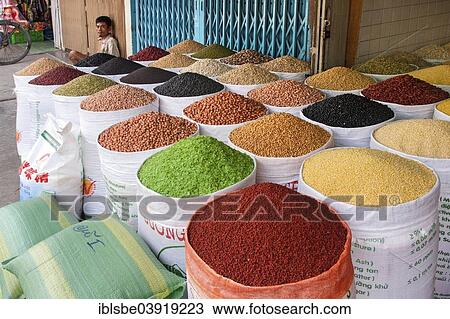 "Market vendor offering various sorts of beans, spices and grains, Ho Chi Minh City, Vietnam, Asia" View Large Photo Image Stock Image - "Market vendor offering various sorts of beans, spices and grains, Ho Chi Minh City, Vietnam, Asia". Fotosearch