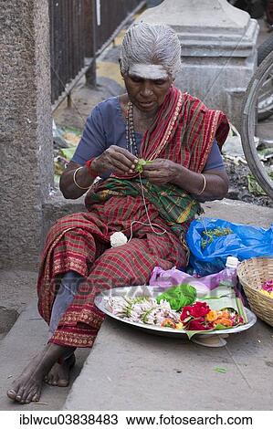 "Market woman producing floral decorations, Madurai, Tamil Nadu, India, Asia" View Large Photo Image Stock Image - "Market woman producing floral decorations, Madurai, Tamil Nadu, India, Asia". Fotosearch