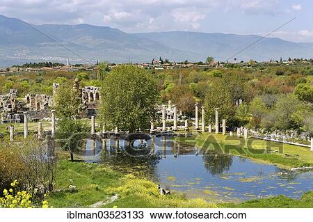 Stock Image - "Marketplace or agora and Baths of Hadrian, behind the Geyre village, Aphrodisias, Aydin province, Aegean region, Turkey, Asia". Fotosearch