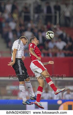 Stock Image - "Martin Harnik, #11 Austria, and Holger Badstuber, #14 Germany, fight for the ball during the WC qualifier soccer game on September 11, 2012 in Vienna, Austria, Europe". Fotosearch