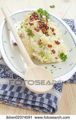 Stock Image - Mashed potatoes with bacon and onions. Fotosearch