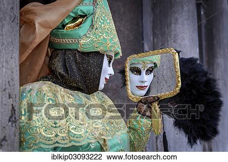 "Masked woman with a mirror at the Carnival in Venice, San Marco, Venice, Italy, Europe" View Large Photo Image Stock Image - "Masked woman with a mirror at the Carnival in Venice, San Marco, Venice, Italy, Europe". Fotosearch