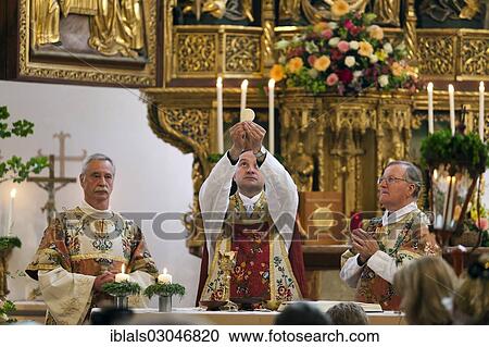 Stock Image - "Mass for Corpus Christi in the Catholic Church in Hallstatt, Hallstatt, Salzkammergut, Upper Austria, Austria, Europe". Fotosearch