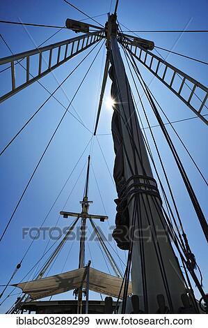 Stock Photo - "Masts and awning, Buginese Schooner, Seven Seas Liveaboard, Dampier Strait, West Papua, Indonesia, Asia". Fotosearch