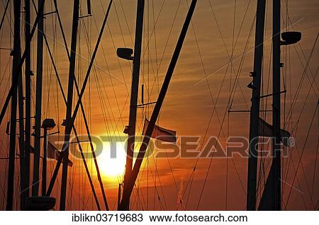 "Masts in the marina at sunrise, Heiligenhafen, Schleswig-Holstein, Germany, Europe" View Large Photo Image Stock Image - "Masts in the marina at sunrise, Heiligenhafen, Schleswig-Holstein, Germany, Europe". Fotosearch