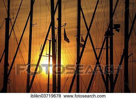 "Masts in the marina at sunrise, Heiligenhafen, Schleswig-Holstein, Germany, Europe" View Large Photo Image Stock Photo - "Masts in the marina at sunrise, Heiligenhafen, Schleswig-Holstein, Germany, Europe". Fotosearch