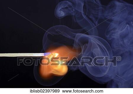 Stock Photo - "Matchstick being ignited, with blue smoke". Fotosearch