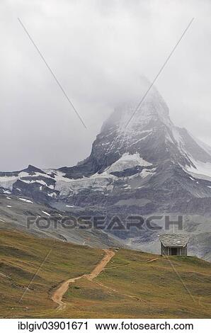 Stock Image - "Matterhorn, 4478 m, in the clouds, Rotenboden, Zermatt, Canton of Valais, Switzerland, Europe". Fotosearch