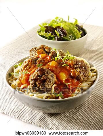 "Meat balls on spaghetti with a tomato, basil and shallot sauce, with a green salad" View Large Photo Image Stock Image - "Meat balls on spaghetti with a tomato, basil and shallot sauce, with a green salad". Fotosearch