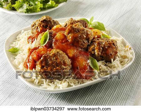 Meat balls with a ragu sauce on rice View Large Photo Image Stock Photo - Meat balls with a ragu sauce on rice. Fotosearch