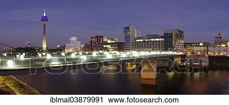 Stock Image - "Media Harbour with Rhine Tower and the Gehry Buildings, Dusseldorf, North Rhine-Westphalia, Germany, Europe". Fotosearch