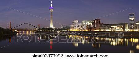 Stock Image - "Media Harbour with Rhine Tower and the Gehry Buildings, Dusseldorf, North Rhine-Westphalia, Germany, Europe". Fotosearch