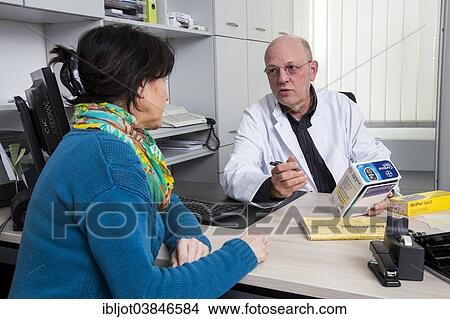 "Medical practice, doctor talking to a diabetes patient about the use of blood glucose meters, Germany, Europe" View Large Photo Image Picture - "Medical practice, doctor talking to a diabetes patient about the use of blood glucose meters, Germany, Europe". Fotosearch
