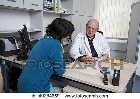 "Medical practice, doctor talking to a patient about an ECG finding, Germany, Europe" View Large Photo Image Stock Image - "Medical practice, doctor talking to a patient about an ECG finding, Germany, Europe". Fotosearch
