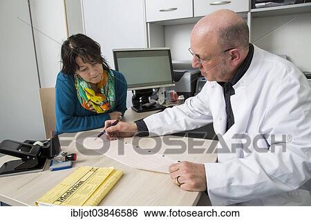 "Medical practice, doctor talking to a patient about an ECG finding, Germany, Europe" View Large Photo Image Stock Photograph - "Medical practice, doctor talking to a patient about an ECG finding, Germany, Europe". Fotosearch