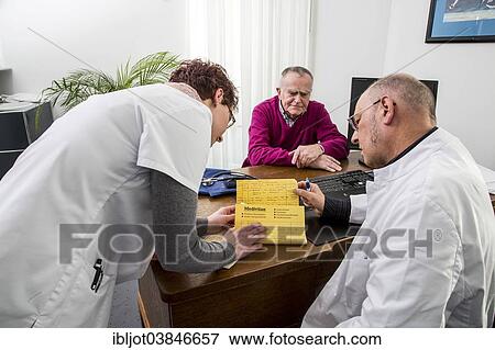 "Medical practice, elderly patient talking to his doctor and the assistant, Germany, Europe" View Large Photo Image Stock Photo - "Medical practice, elderly patient talking to his doctor and the assistant, Germany, Europe". Fotosearch