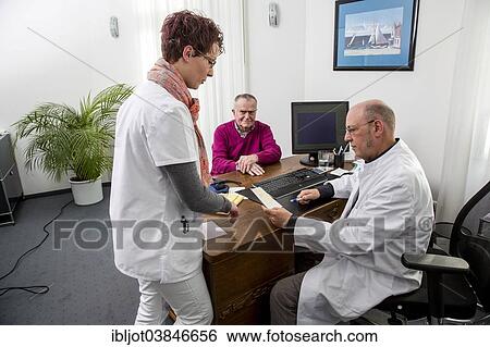 "Medical practice, elderly patient talking to his doctor and the assistant, Germany, Europe" View Large Photo Image Stock Photograph - "Medical practice, elderly patient talking to his doctor and the assistant, Germany, Europe". Fotosearch
