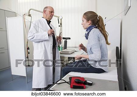 "Medical practice, internal specialist discusses results with a young patient, Germany, Europe" View Large Photo Image Stock Image - "Medical practice, internal specialist discusses results with a young patient, Germany, Europe". Fotosearch