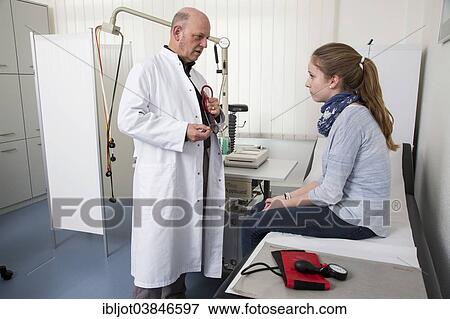 Stock Photo - "Medical practice, internal specialist discusses results with a young patient, Germany, Europe". Fotosearch