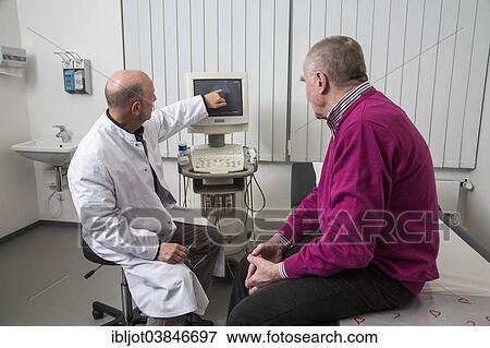 "Medical practice, internist talking to an elderly patient about images from a sonographic scanner, Germany, Europe" View Large Photo Image Stock Photo - "Medical practice, internist talking to an elderly patient about images from a sonographic scanner, Germany, Europe". Fotosearch