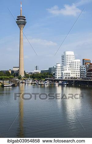 Stock Photo - "Medienhafen or Media Harbour and Rheinturm, Dusseldorf, Rhineland, North Rhine-Westphalia, Germany, Europe". Fotosearch