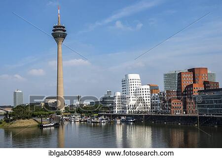 Stock Photo - "Medienhafen or Media Harbour and Rheinturm, Dusseldorf, Rhineland, North Rhine-Westphalia, Germany, Europe". Fotosearch
