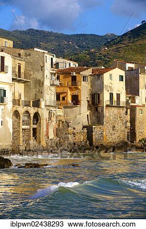 Stock Image - "Medieval houses and seafront of old Cefalu, Sicily, Italy, Europe". Fotosearch