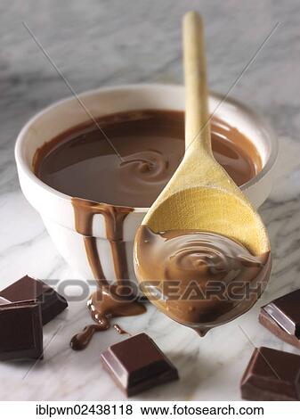 Stock Photo - Melted chocolate being stirred in a bowl. Fotosearch
