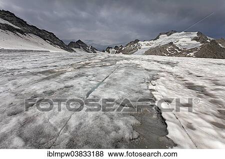"Melting dirty glacier forming crevasses, Cavardiras Glacier, behind Oberalpstock, Graubunden, Switzerland, Europe" View Large Photo Image Stock Photo - "Melting dirty glacier forming crevasses, Cavardiras Glacier, behind Oberalpstock, Graubunden, Switzerland, Europe". Fotosearch